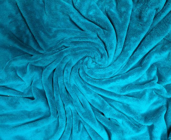 un plaid épais enroulé façon spirale